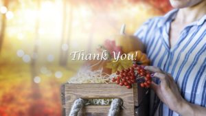 female person holding a fall fruit basket to express thank you from TDI Custom Packaging