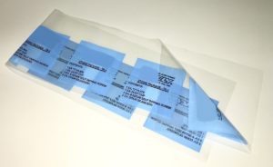 clear centerfold film folded over with blue blocks and text printed on it
