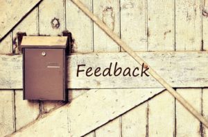 A mailbox for feedback attached to a wooden barn door. A mailbox for feedback attached to a wooden barn door.