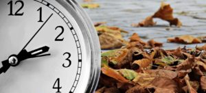 Clock with fall background to symbolize lead times for custom poly bags in fall