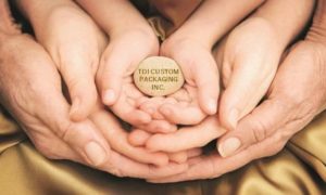 image of people holding each other's hands with words "TDI CUSTOM PACKAGING, INC." to symbolize core values that create custom packaging solutions
