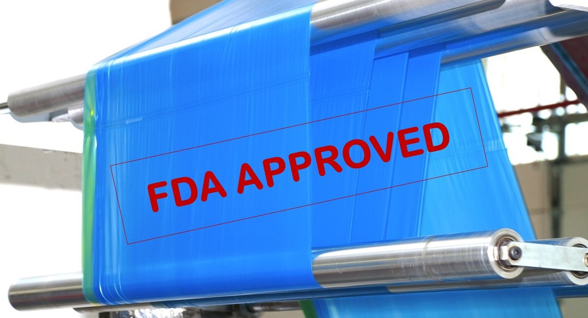 image of blue poly film on a production line with words "FDA APPROVED" in red