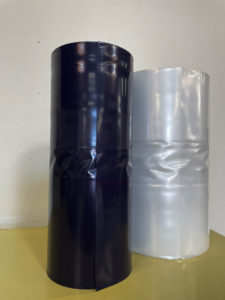 image of one blue roll and one clear roll of trash bags on a roll