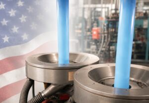 image of TDI Custom Packaging blue poly tubing extruder with in the background a faded American flag