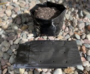 image of black nursery grow bags with custom vent holes that are manufactured by TDI Custom Packaging