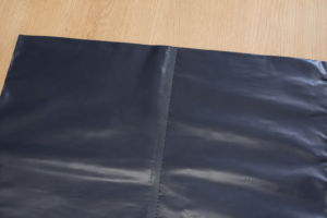 close-up of easy tear perforated poly film as manufactured by TDI Custom Packaging
